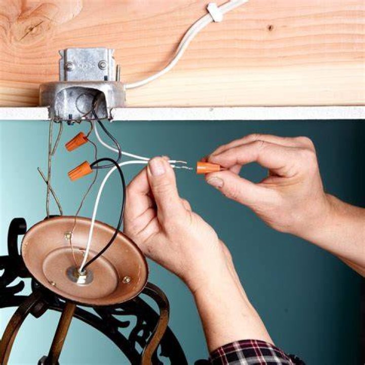 When installing a light fixture which wire is hot?